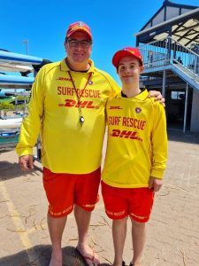 Surf rescue team in Australia wearing yellow and red uniforms, representing community safety and NDIS-supported emergency response.