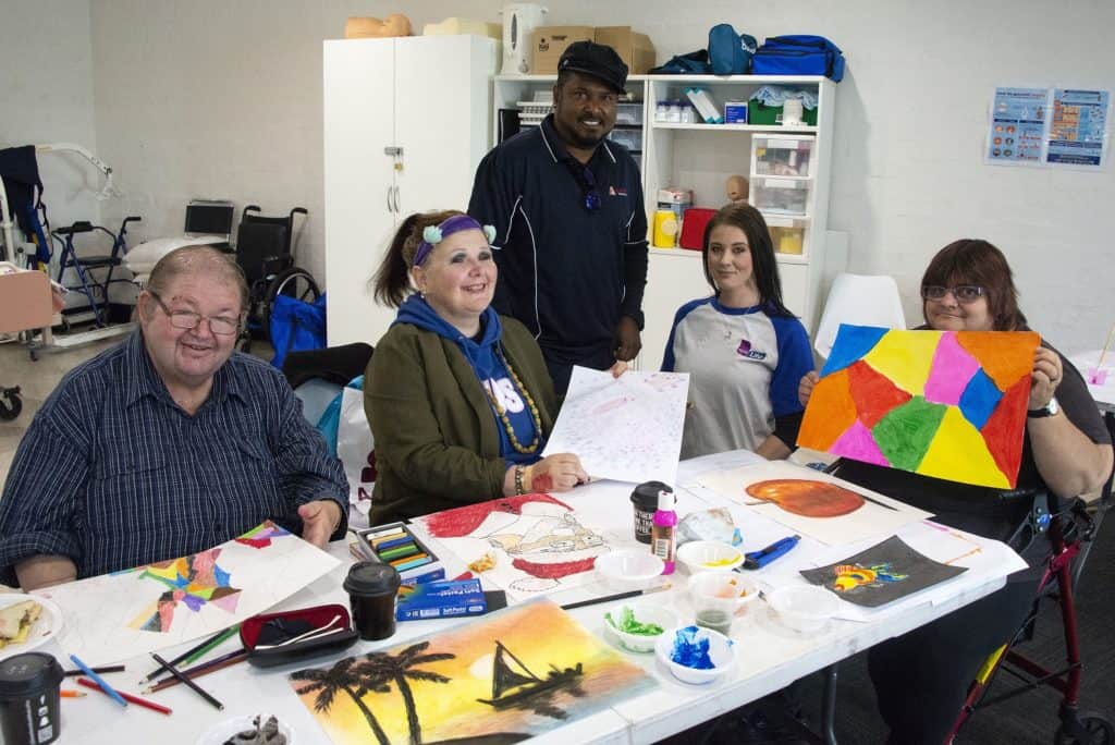 Creative NDIS art therapy session for individuals with disabilities at Assured Care Solutions in Australia, promoting inclusion and emotional wellbeing.