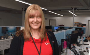 Compassionate NDIS care professional in an office setting, representing Assured Care Solutions as a trusted provider of aged and disability support services.
