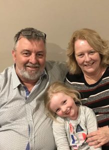 Family members caring for an elderly loved one at home in Australia, creating a warm, supportive, and nurturing environment.